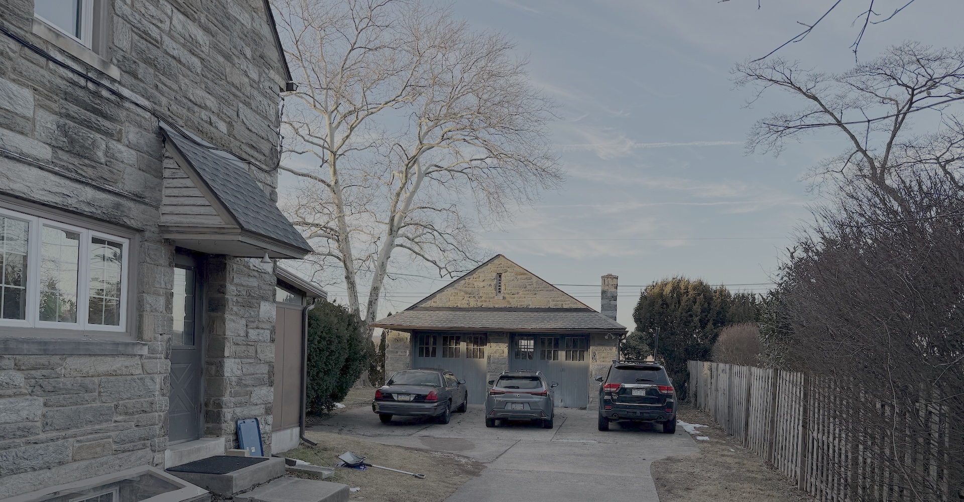 Rear parking lot and carriage house garage