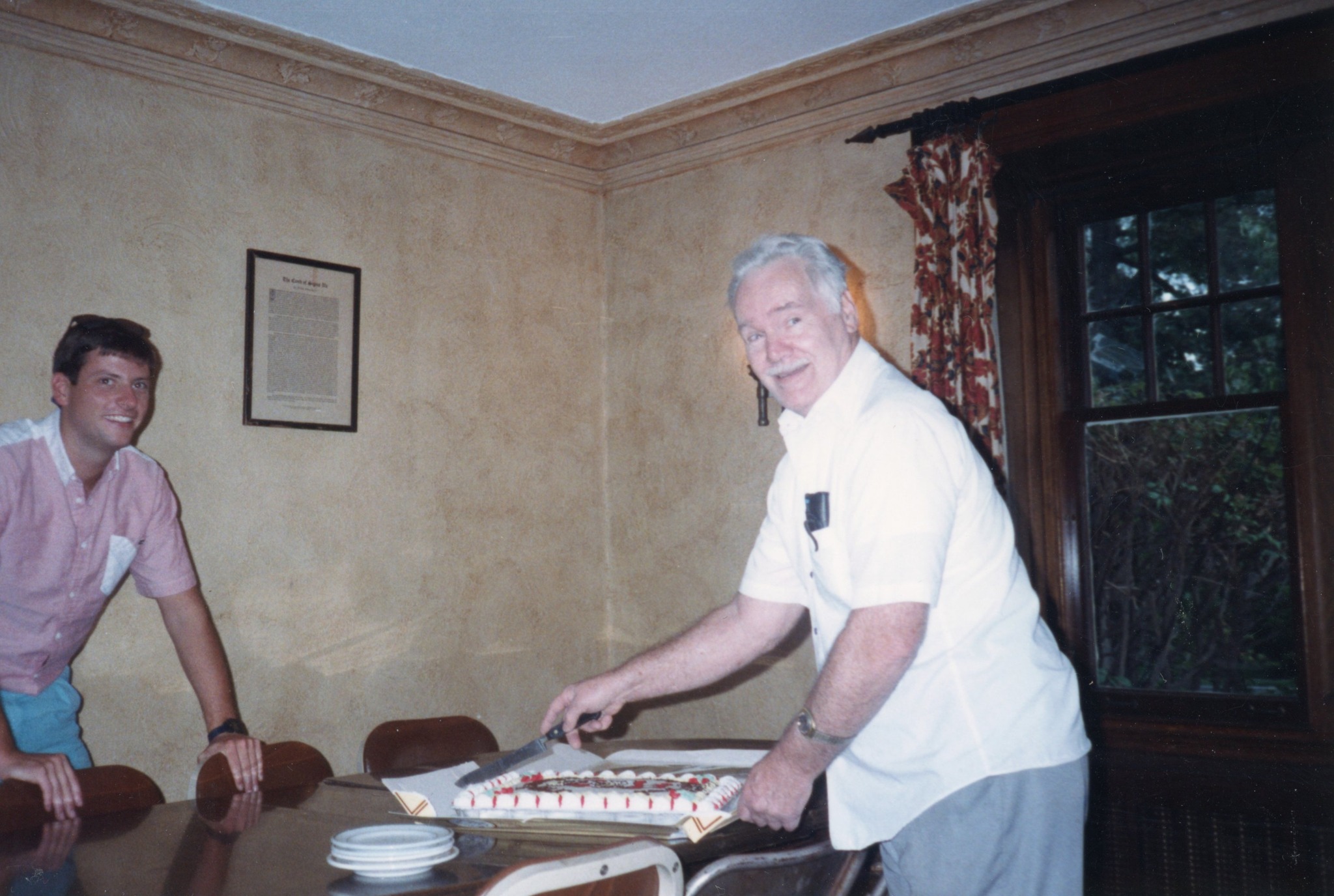 Allen Mom Dubbs cutting cake in the dining room