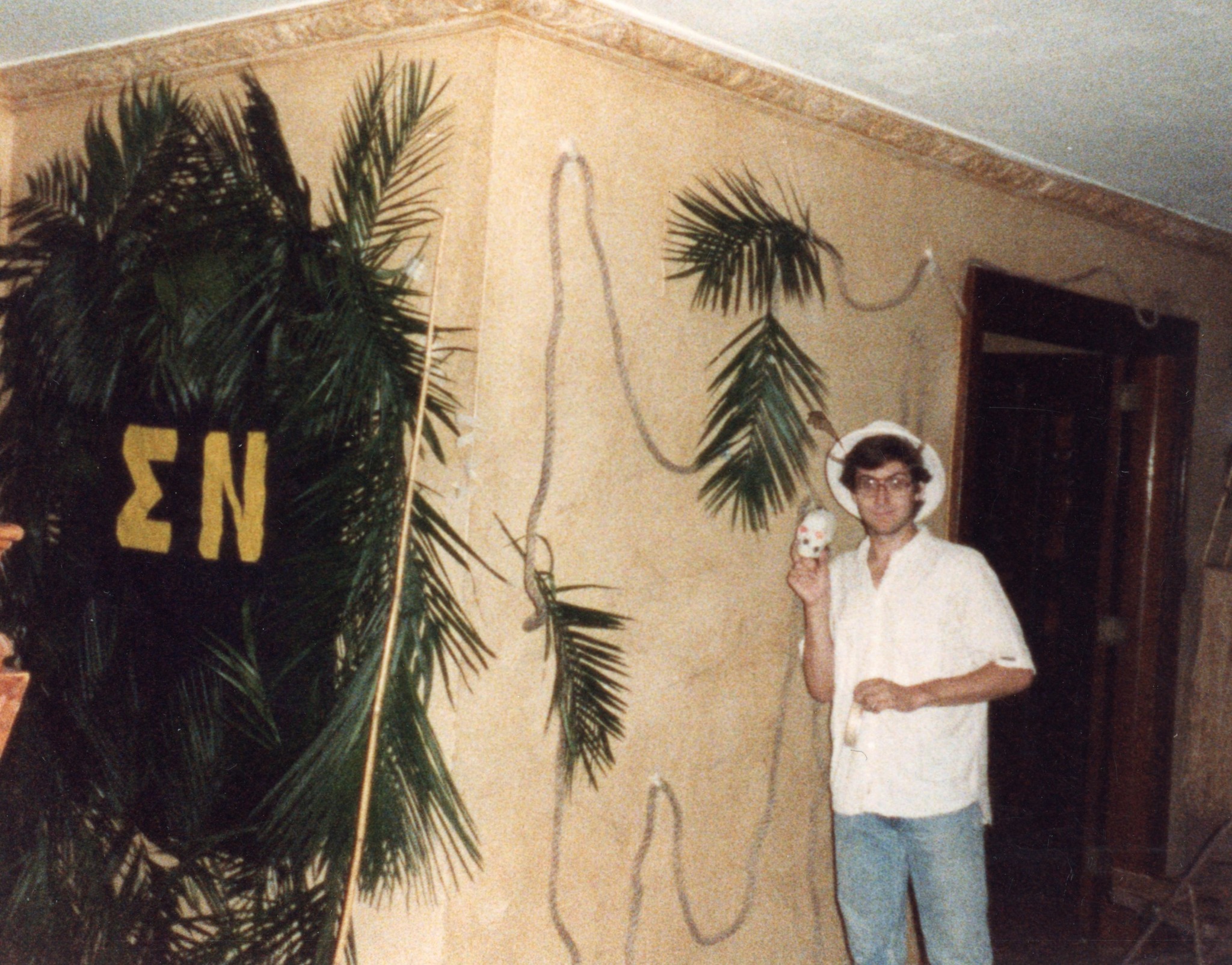 Hawaiian Party setup in the house with palm trees and SN letters